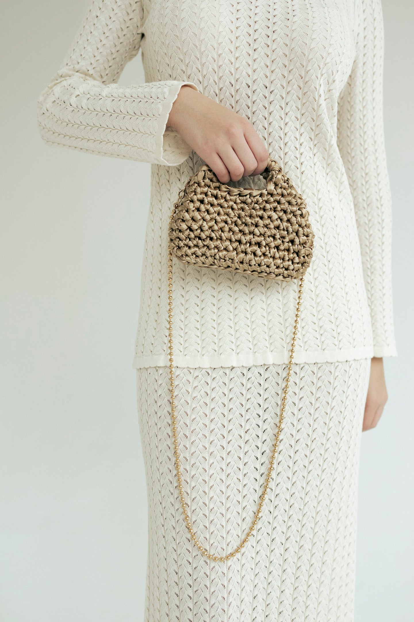 Golden mini crochet bag